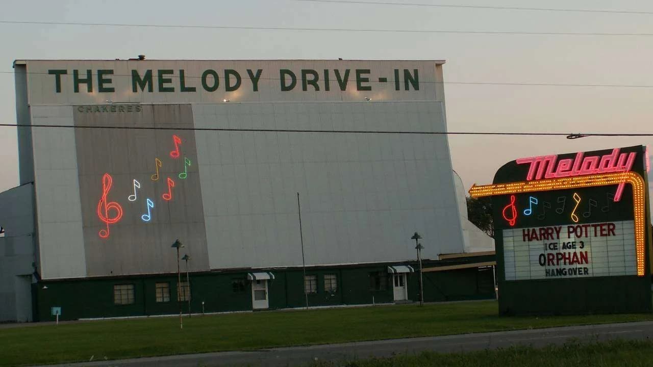 Drive-in movie screen at dusk