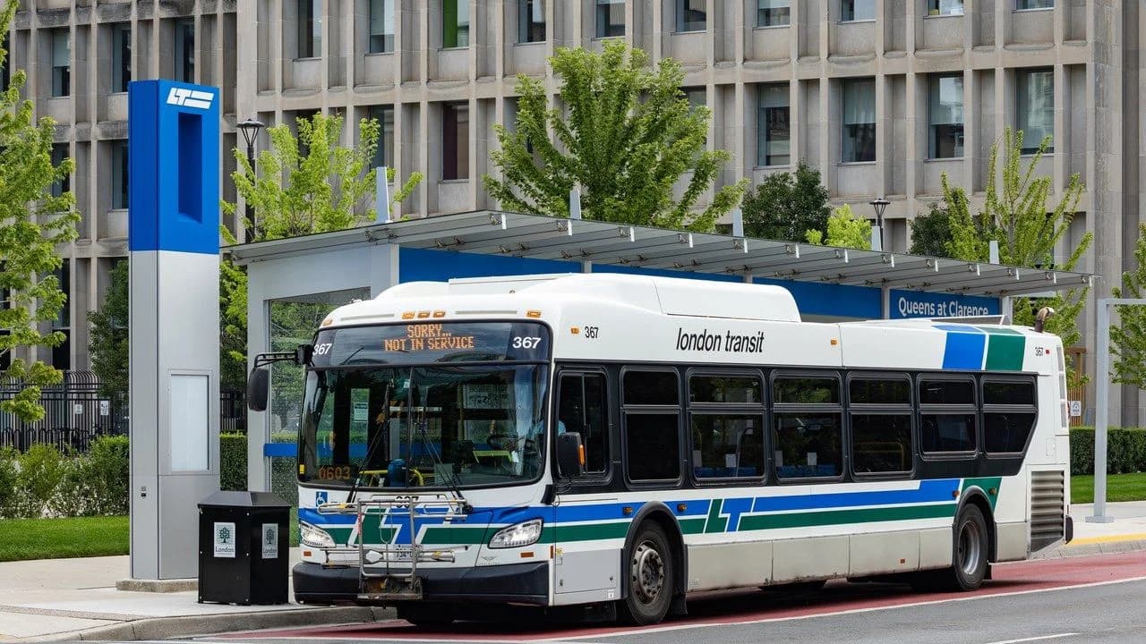 A public transit bus at a bus stop in Ontario; no people visible.